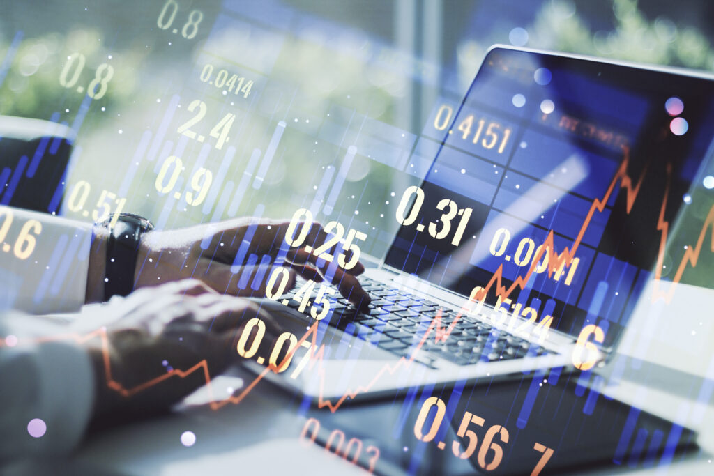 abstract creative financial graph with hand typing laptop background financial trading concept multiexposure