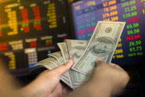 close up hand holding paper currencies