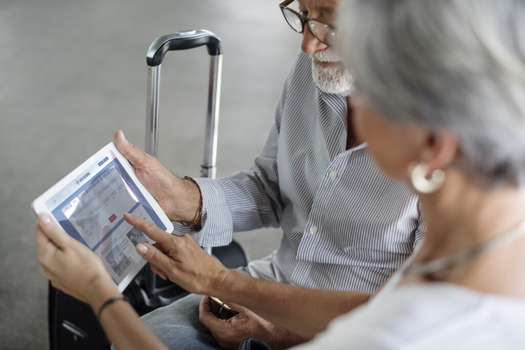 senior couple traveling airport scene