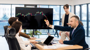 young worker leading business meeting about cryptocurrencies office