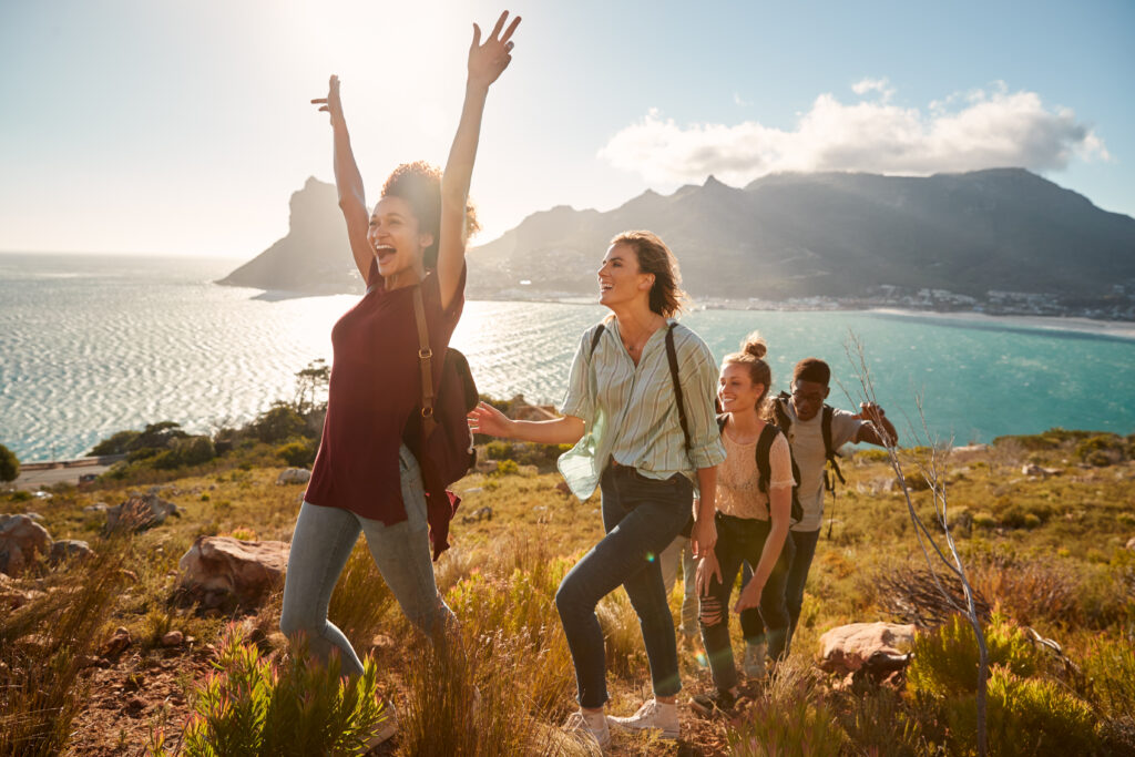 young adult friends hiking single file uphill cele 2023 11 27 05 13 07 utc