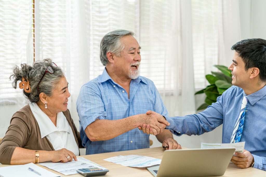 insurance agency manager handshake with asian coup 2024 02 23 05 03 55 utc